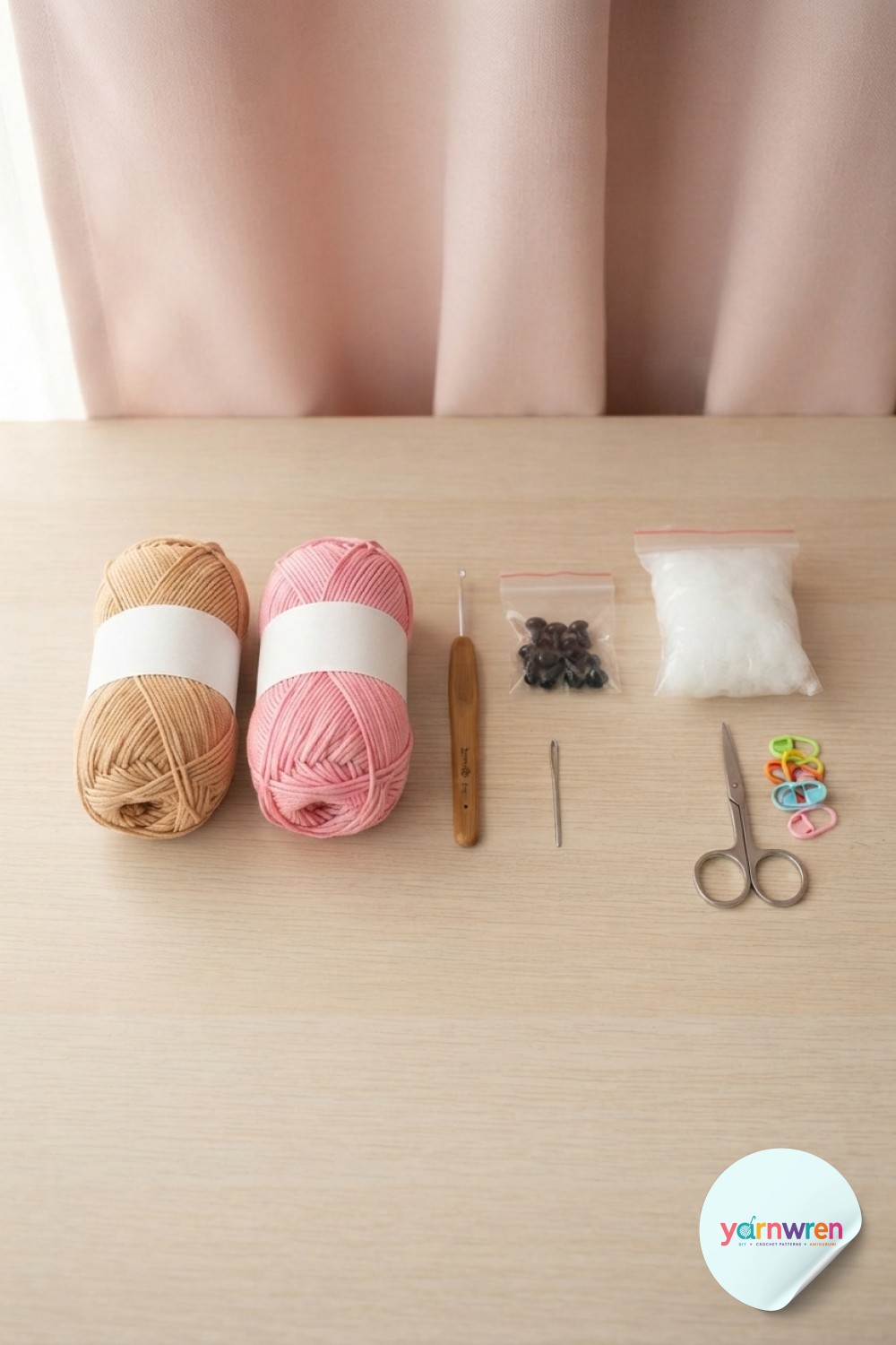 Flat lay of yarn, hook, eyes, and stuffing arranged before starting a crochet puppy amigurumi project